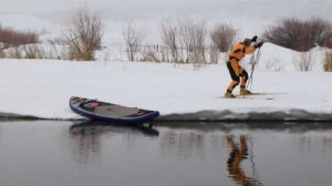 Eugene cross-country skiing off the bank of the river
